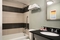 Days Hotel by Wyndham Allentown Airport Lehigh Valley - All standard bathrooms include a shower, bath tub and sink. Amenities include a hairdryer and bright lighting.