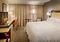Marriott St. Louis Airport - The standard room includes a refrigerator, flat screen TV, and luxurious bedding.