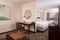 SpringHill Suites Orlando Airport - The standard room with 2 queen beds has a separate living room with a sleeper sofa, a microwave, and mini refrigerator.