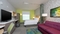 Home2 Suites Indianapolis Airport - The standard room with a queen size bed includes a full size sleeper sofa.