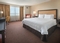 Hampton Inn JFK - The standard room with a king bed has plush bedding so you can stretch out and relax with comfort. The room includes free WiFi, a coffee maker, and a large desk and chair.