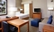 Homewood Suites - The standard suite with a king size beds includes a flat screen TV, a desk, a fully equipped kitchen, and a large spacious bathroom.