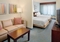 Springhill Suites by Marriott Manchester Airport - The room with two double beds is a large and spacious area which also includes a sleeper sofa.