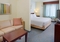 Springhill Suites by Marriott Manchester Airport - The room with a king bed is a large and spacious area which also includes a sleeper sofa.