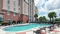 Hampton Inn & Suites Orlando Airport - Relax and unwind in the hotel's large outdoor pool.
