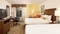 Hilton Garden Inn Orlando Airport - The standard room with two queen beds includes a 32