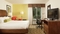 Hilton Garden Inn Orlando Airport - The standard room with a king sized bed includes a 32