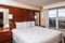 Residence Inn Orlando Airport - The standard king room has a separate living, dining, and kitchen area. 