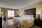 Holiday Inn Hotel & Suites - The standard room includes a 32 inch TV, refrigerator, and microwave.