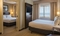 Sonesta Chicago O'Hare Airport - The standard room with two queen size bedding in two separate rooms includes a HDTV, refrigerator, microwave, and free WiFi.