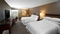 Sheraton Pittsburgh Airport Hotel - The standard guest room with two double beds features 300 thread count sheets, and down comforters for a good nights rest.