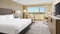 DoubleTree by Hilton Orlando Airport - The standard room with king bedding includes a 50