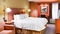 Hampton Inn Pittsburgh Airport - The standard room with a king size beds includes free WiFi, a desk, and coffee maker.