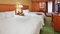 Hampton Inn Pittsburgh Airport - The standard room with two queen size beds includes free WiFi, a desk, and coffee maker.