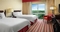 Hilton Charlotte Airport Hotel - The standard room with 2 double beds has a separate living room with a sleeper sofa, 55