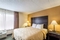 Quality Suites Milwaukee Airport - The standard room with a king size bed includes a full size sleeper sofa.