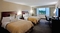 Wyndham Garden Hotel Philadelphia International Airport - The standard room with 2 double beds features a 32-inch flat panel LCD TV, free Wi-Fi, and desk with chair. Guest bathrooms have also been updated with beautiful granite countertops and new massage showerheads.