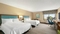 Hampton Inn Portland Airport - The standard room with two queen beds includes a flat screen TV, free WIFI, mini refrigerator, and coffee maker.