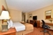 Clarion Hotel Airport - Spacious King room with plush bedding.