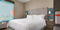 Avid Hotel Ft Lauderdale Airport-Cruise Port - Hotel room with in-room safe and mini refrigerator. Premium 15 inch pillow-top mattress with a duvet, linens, firm or soft pillows, and black-out roller shades.