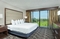 Embassy Suites Nashville Airport - The standard room with a king size bed has a separate living room with a sleeper sofa, TV, a microwave, and refrigerator.