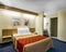 Econo Lodge Denver International Airport - The standard room with a queen size bed includes free WiFi, a desk, and oversized bathroom.